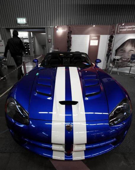an extremely nice looking sport car with striped paint