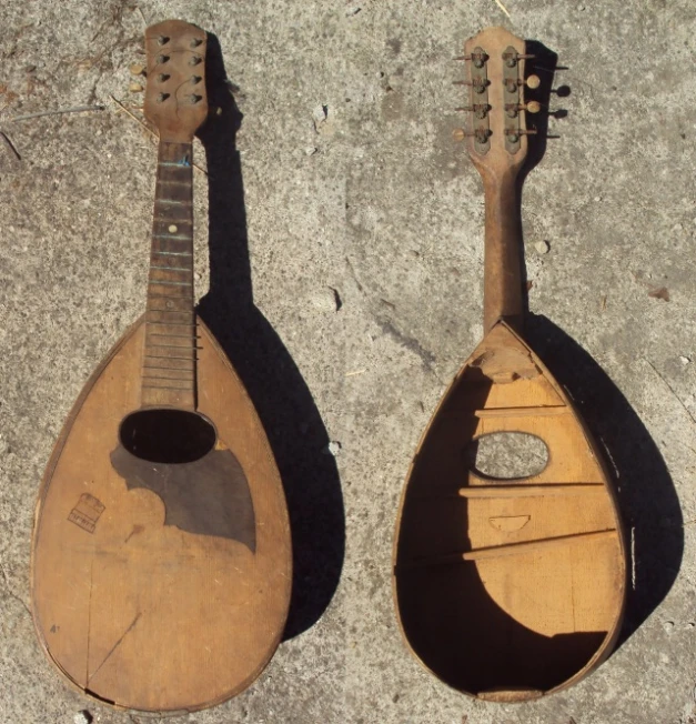 a wooden instrument made from old guitar parts