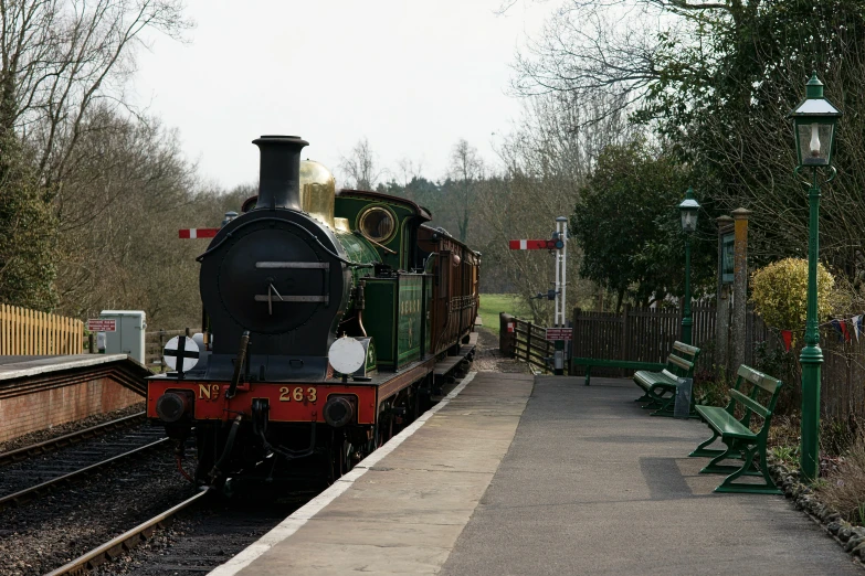 the locomotive train is waiting at the platform