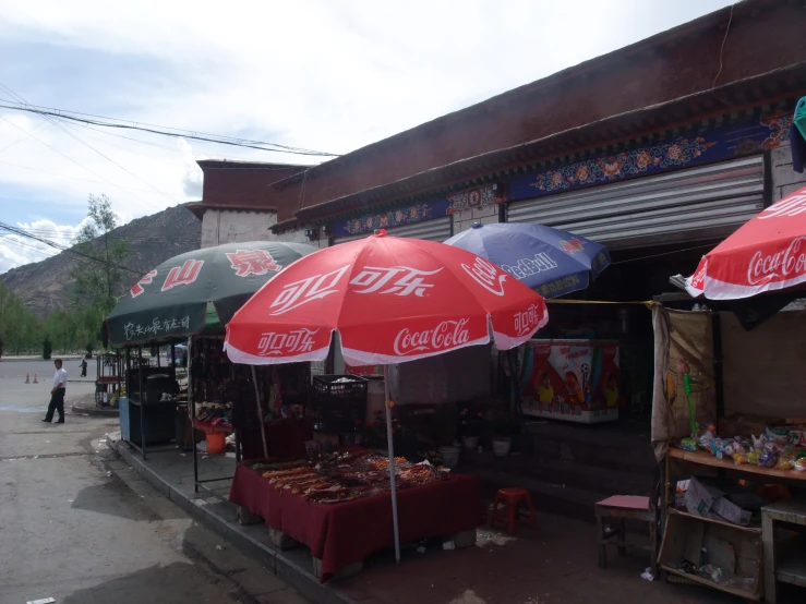 a street corner with many open umbrellas