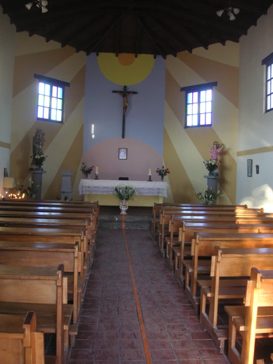 a church with tiled floors and windows is pictured