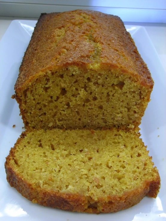 this loaf of orange spice cake has just been sliced