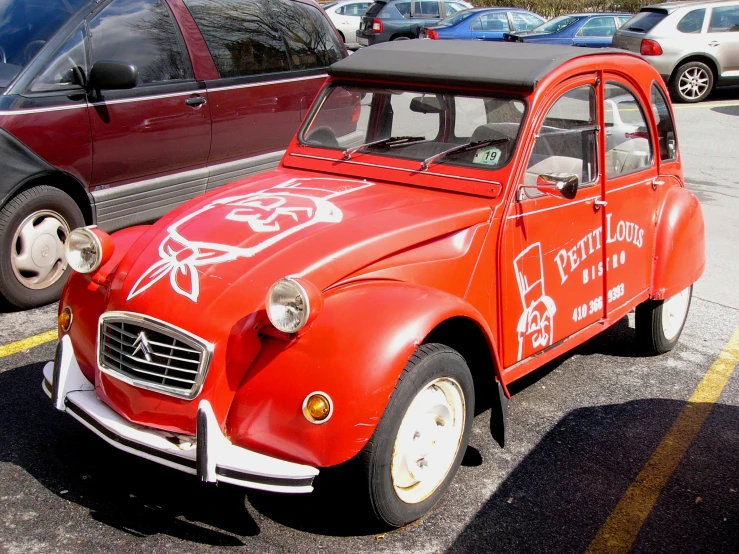 a red beetle parked in a parking lot