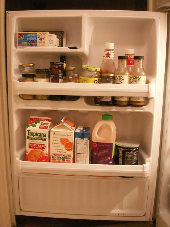 an open fridge with milk and milk