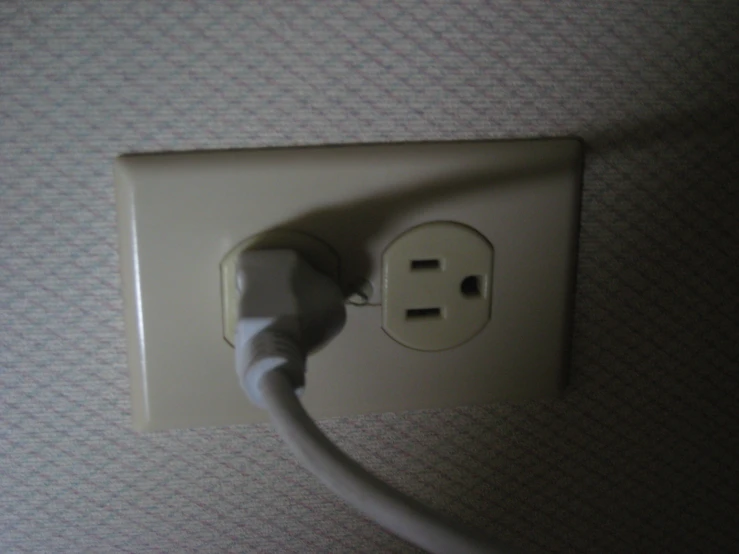 a power outlet that is plugged into the wall