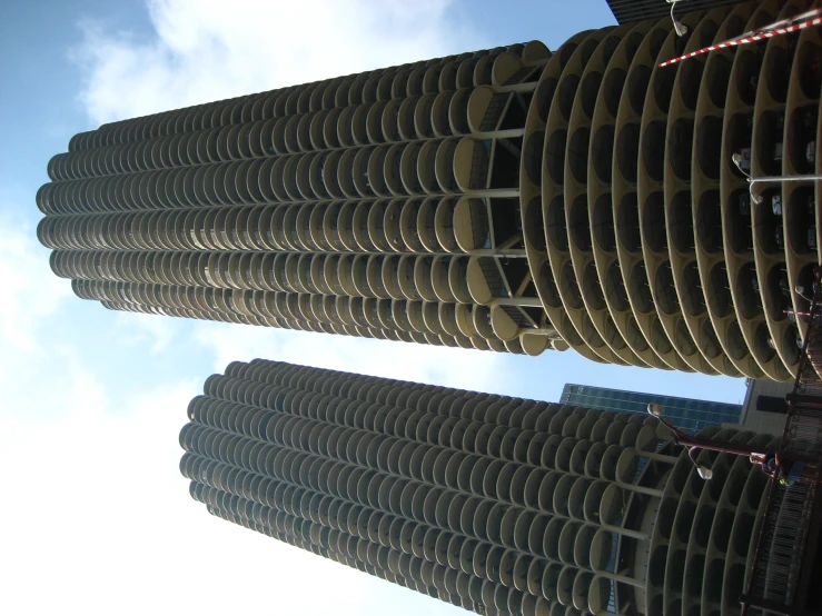 two buildings that have circular balconies on the sides