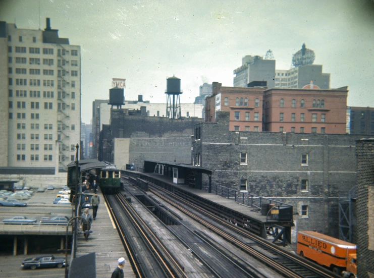 a view of an urban railroad line from across the bridge