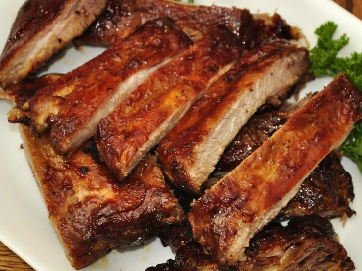 an image of bbq ribs and broccoli on a plate