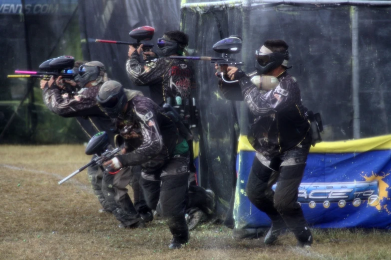 paintball players are attempting to beat each other
