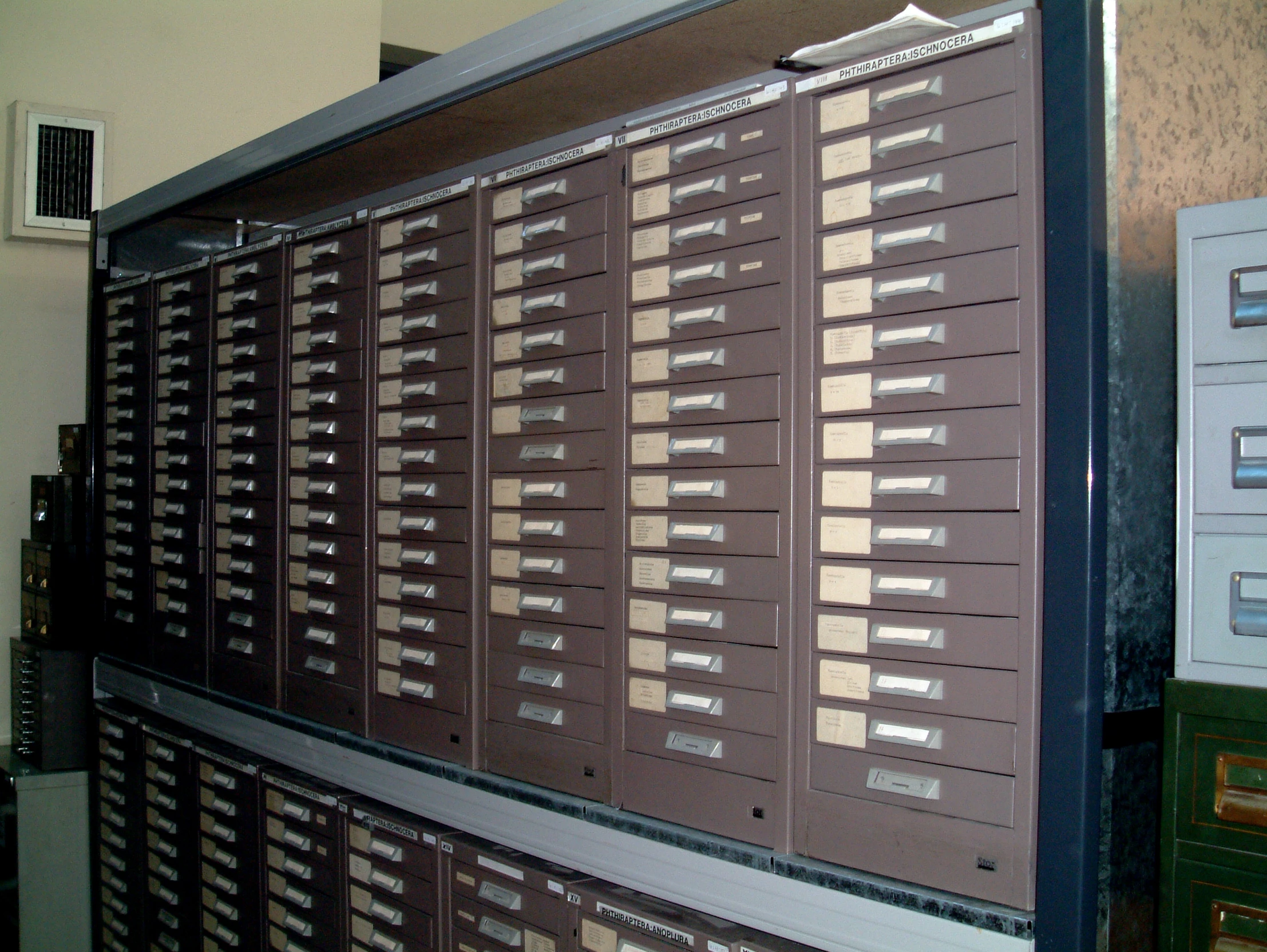 a wall - mounted display of mail boxes in a liry