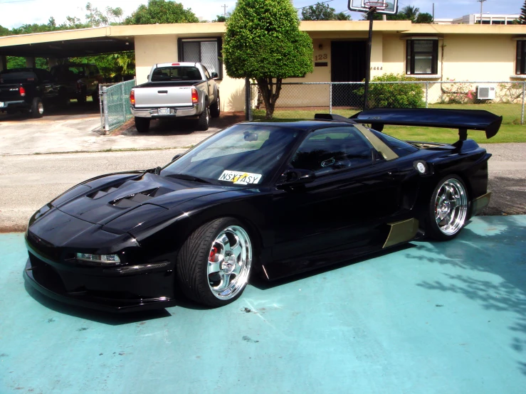 this is a very nice black sports car parked