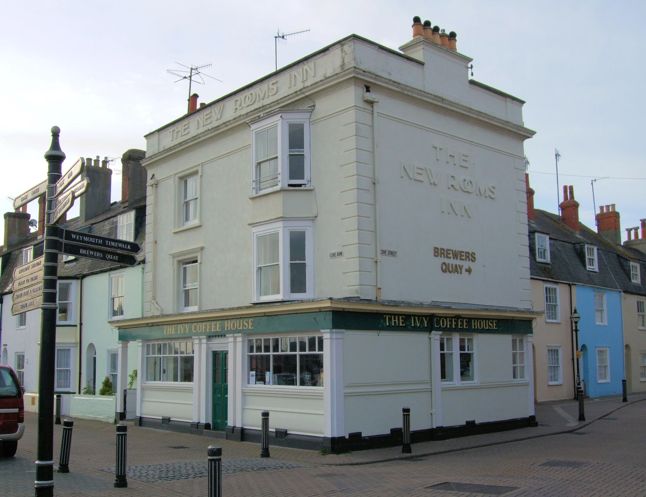 a white building on the street corner