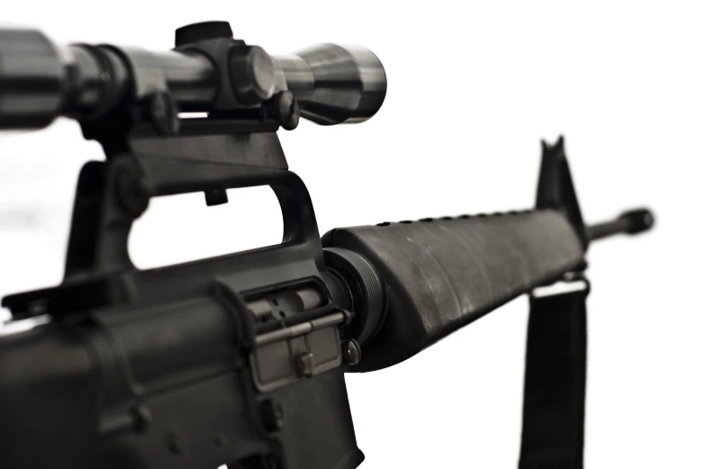 an ar - 15 rifle with a sight - scope and a sightglass attached