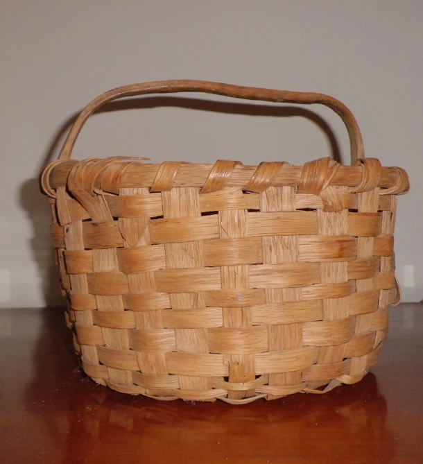 an old, empty basket sitting on a table