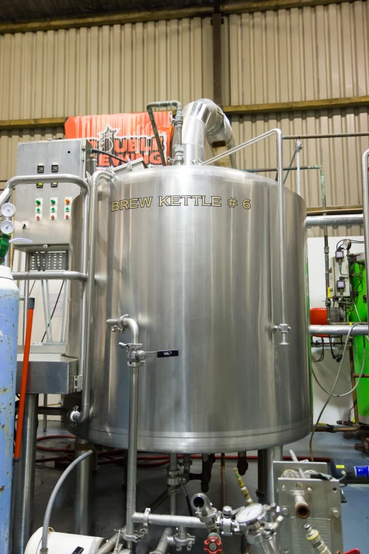 a large metal tank is shown inside a building