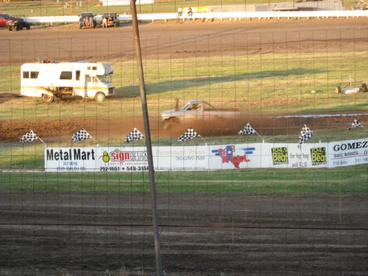 this is a dirt track with a truck on the road