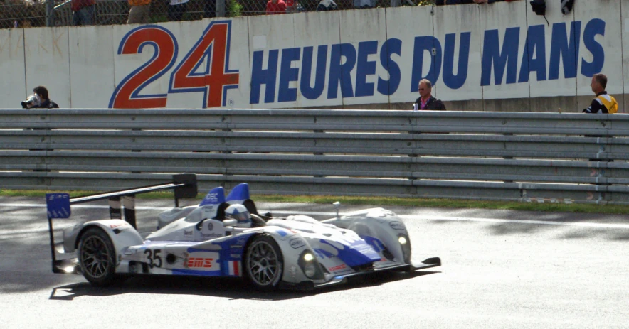 an auto racer is making his way around the track