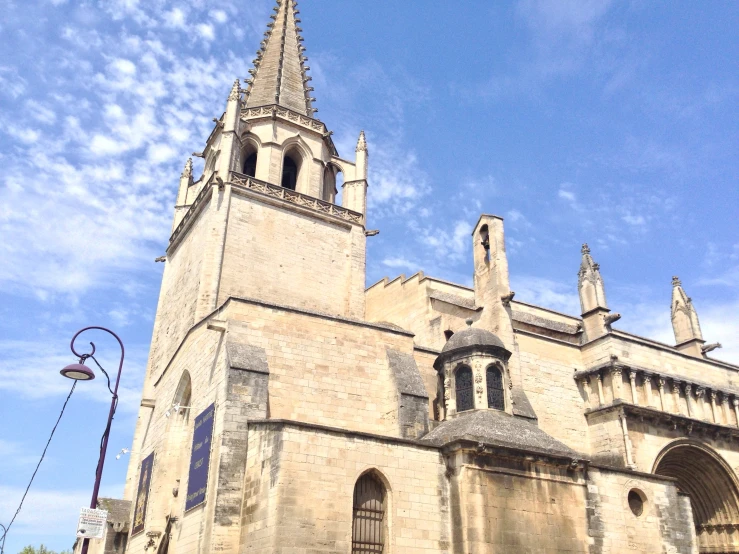 an old looking stone building with two towers