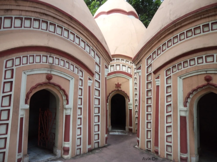 a red building with arches and some windows