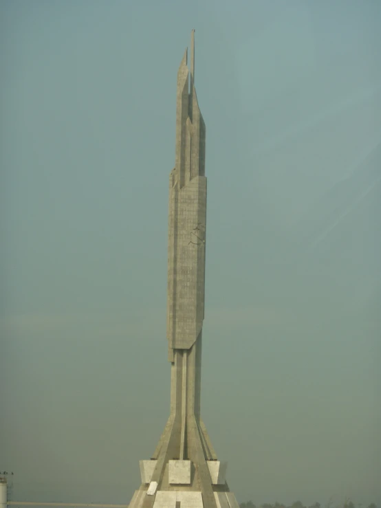 a large statue that looks like a rocket in the air