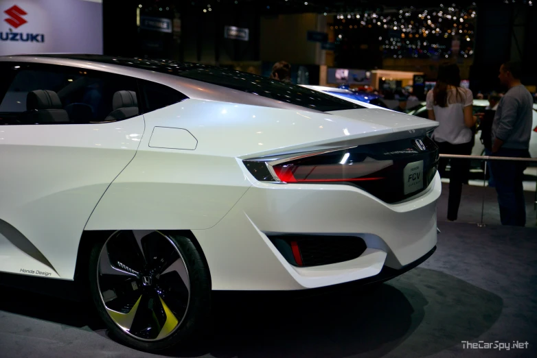 a car showroom is equipped with a white car