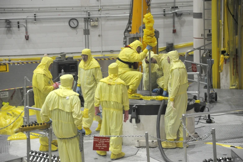 a group of people in yellow rain suits