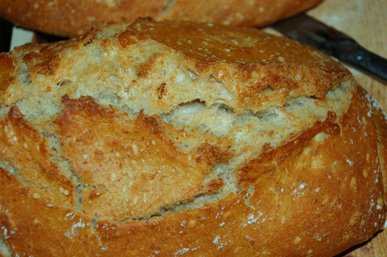 close up image of some bread that is on a  board