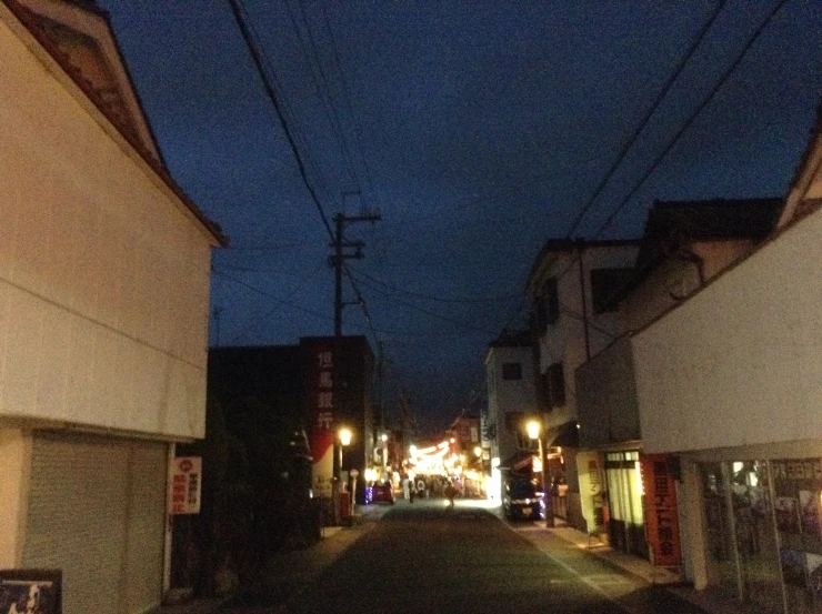 a city street with shops on both sides of it