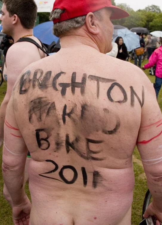 a man with a message written on his back