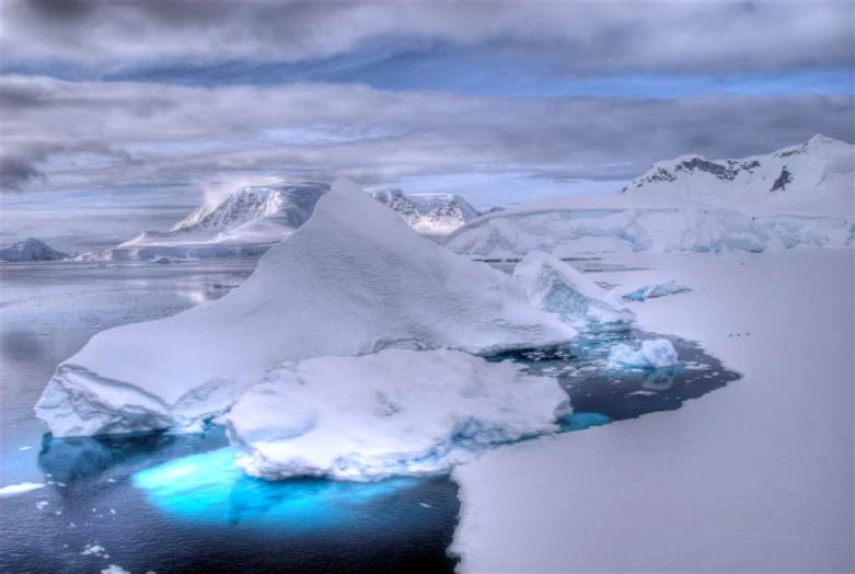 the ice is slowly melting across the water