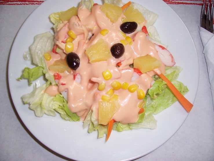 a close up of a plate with salad