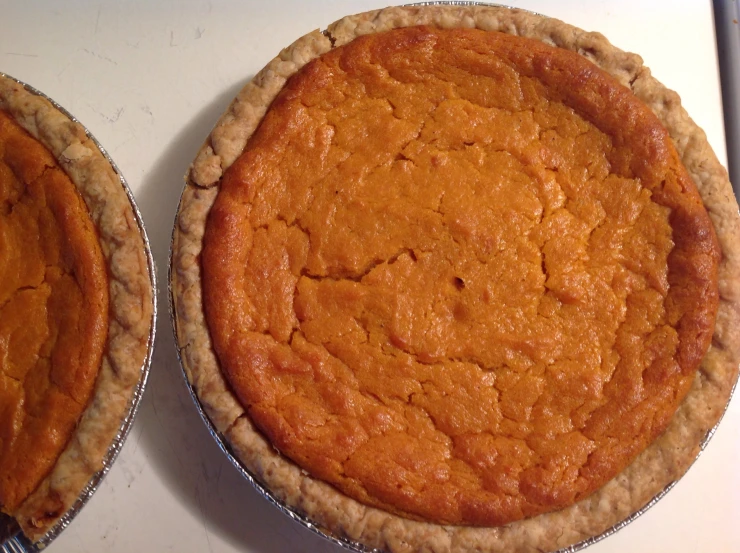 two pies made out of pure pumpkin pie crust