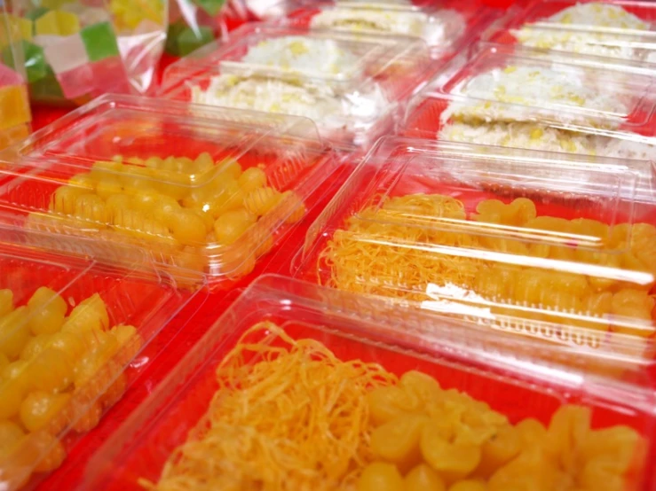 plastic containers with snacks in them stacked on each other