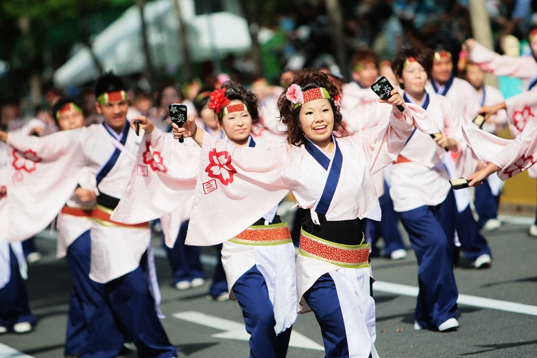 a parade with a woman dancing in the street