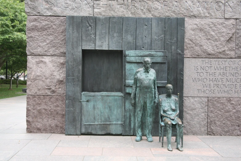 two statues in a building are near the door