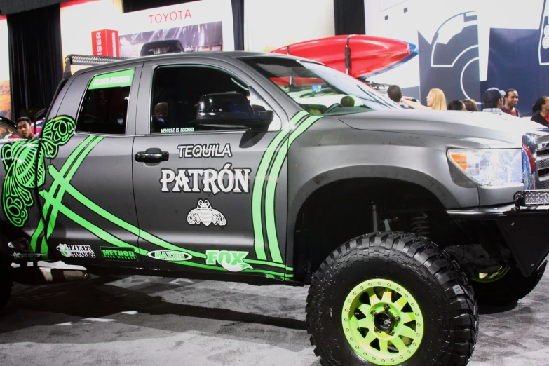 a truck is covered in neon green rims