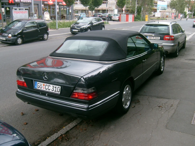 cars are parked along the side of a street