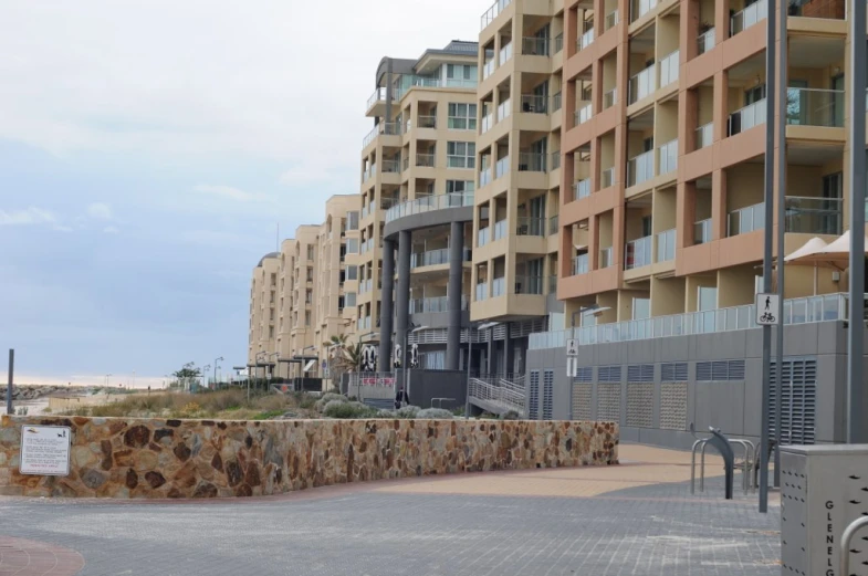 the building next to the walkway is built in an elegant style