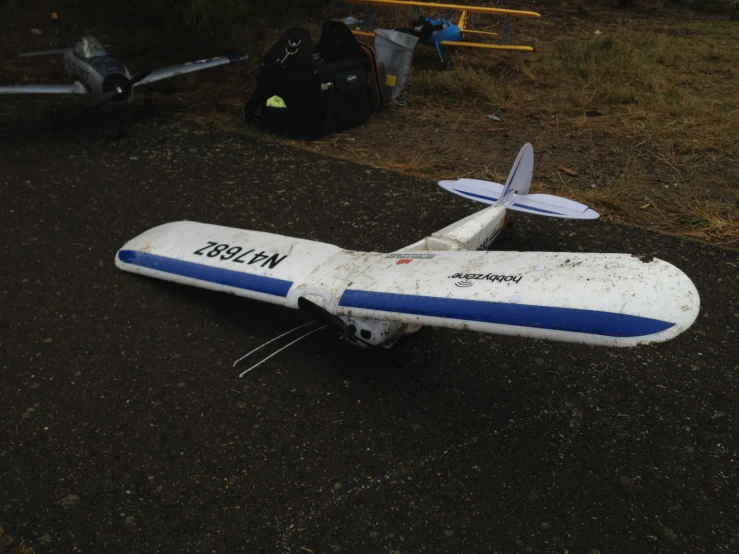 a white airplane that is on some asphalt