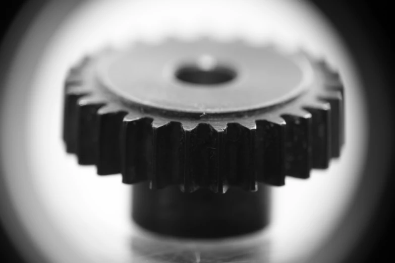 a black and white image of a pinion, or a cogwheel