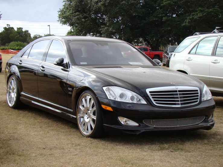 a mercedes car is parked in a field