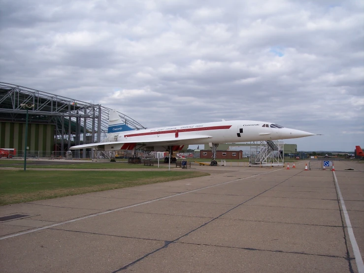 an airplane is parked on a paved surface