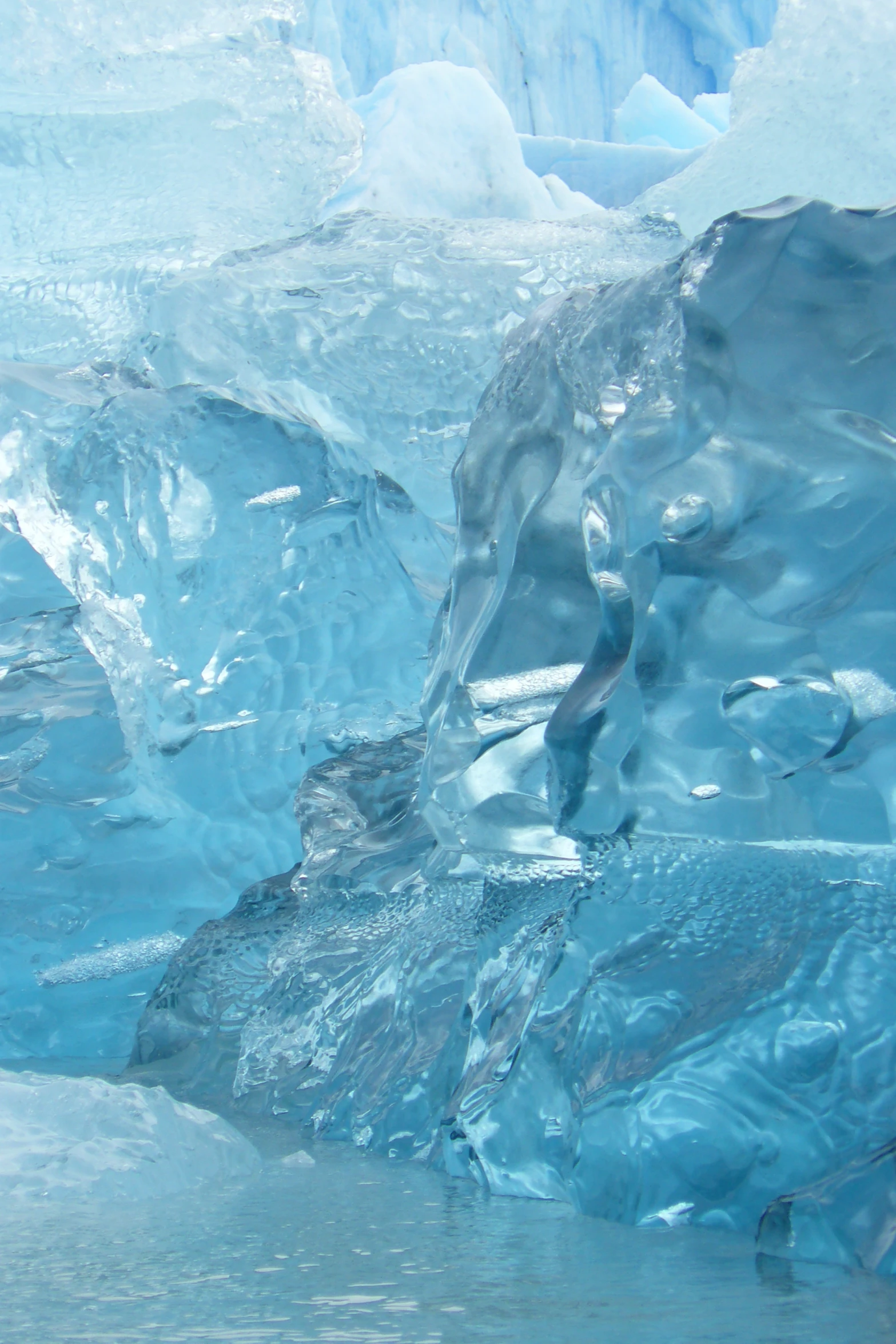 a group of icebergs floating next to each other