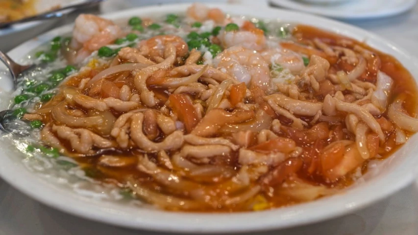 a white bowl filled with lots of food