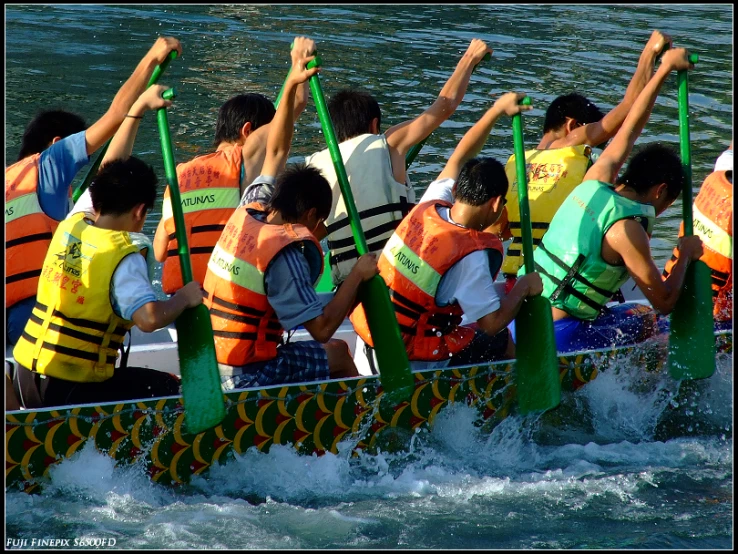 several people in a rowboat on the water