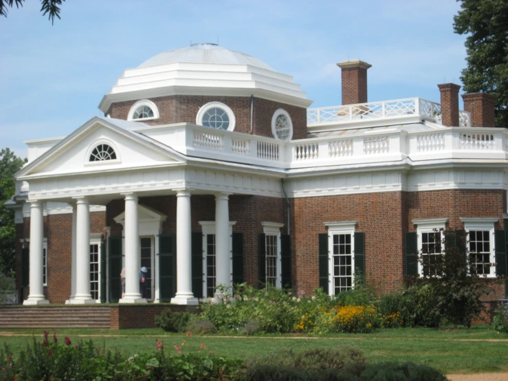 a large red brick building with a clock tower