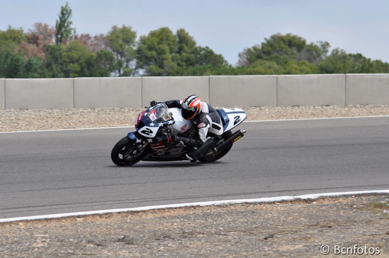 a person riding a motorcycle on a race track