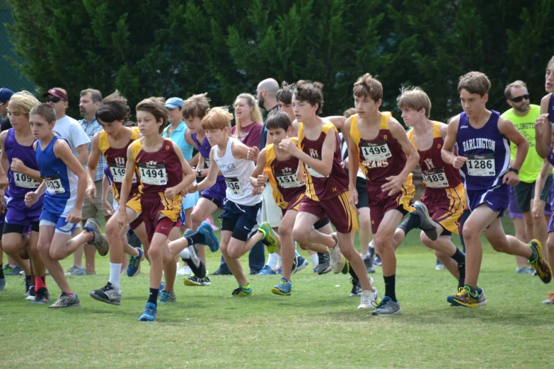 s running in a cross country event on grass