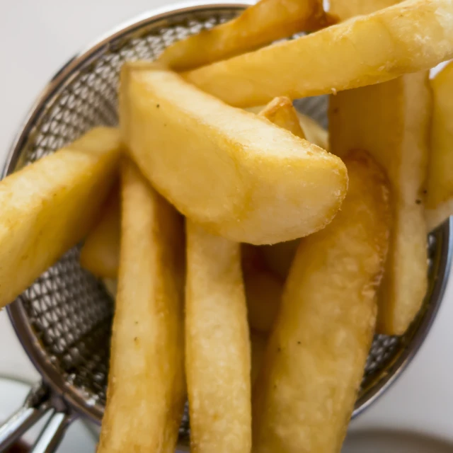some french fries that are in a basket