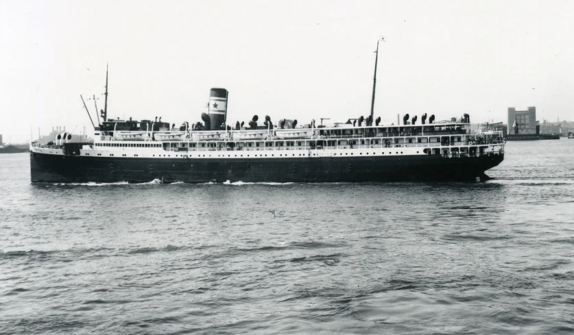 a large white boat that has people on top of it